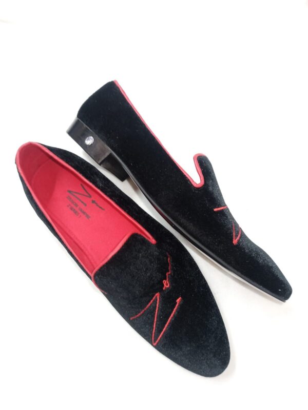 A Pair of Black and Red Shoes