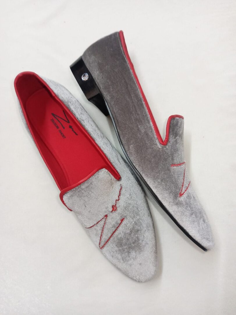 A Pair of Grey and Red Shoes