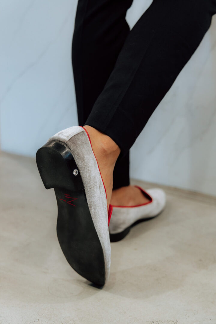 Back view of the grey color loafer with stone