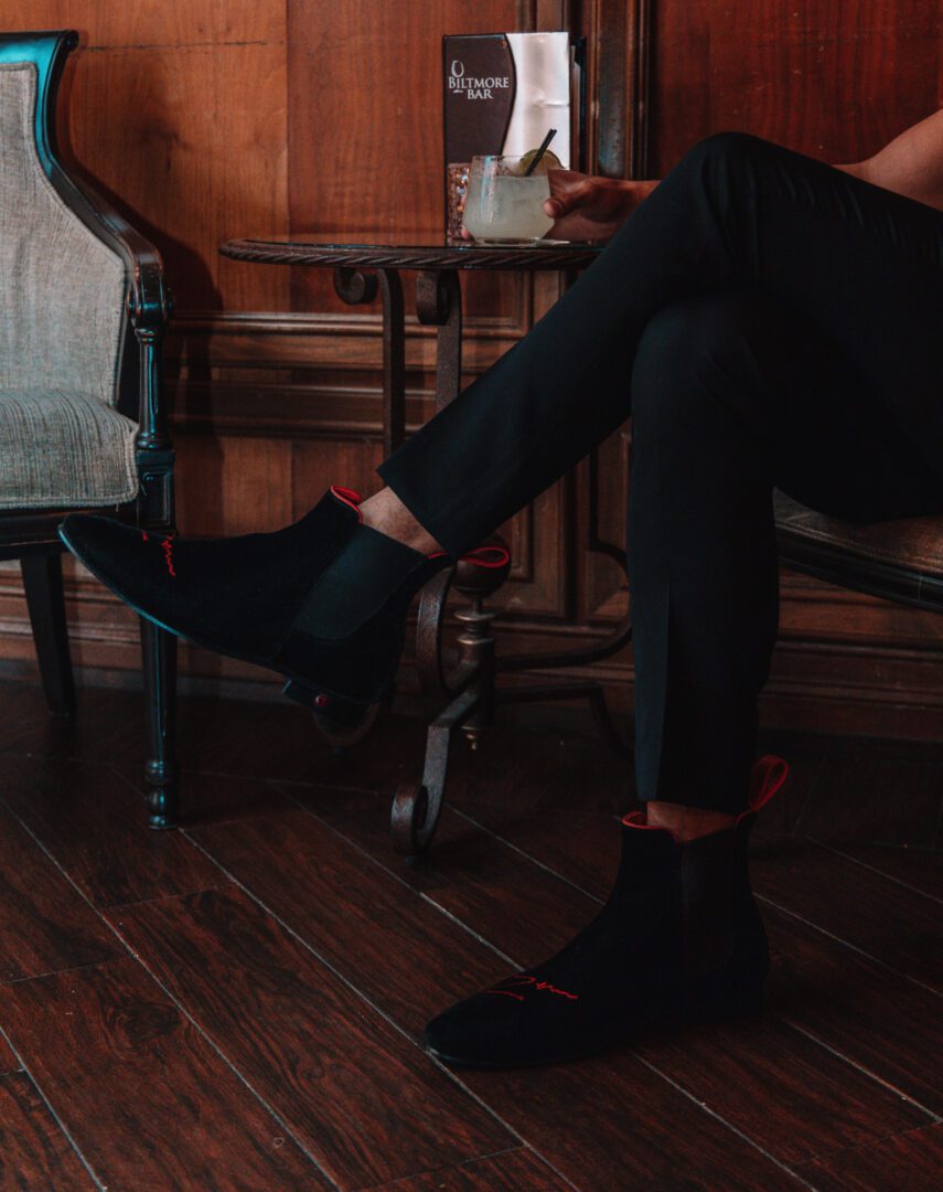 side view of the man in black color loafers