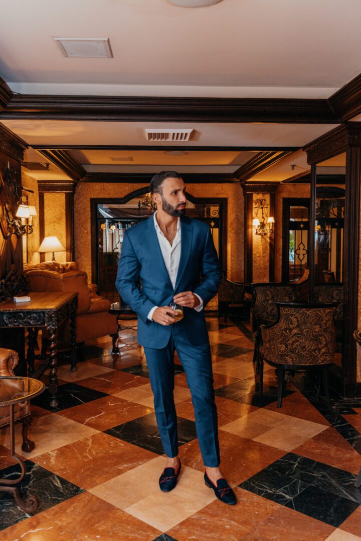 A man in blue color suit and blue color loafer