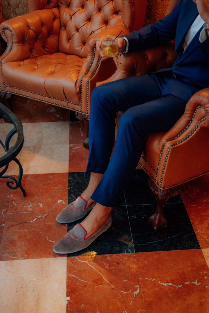 A man in grey color low heel whole cut velvet loafer