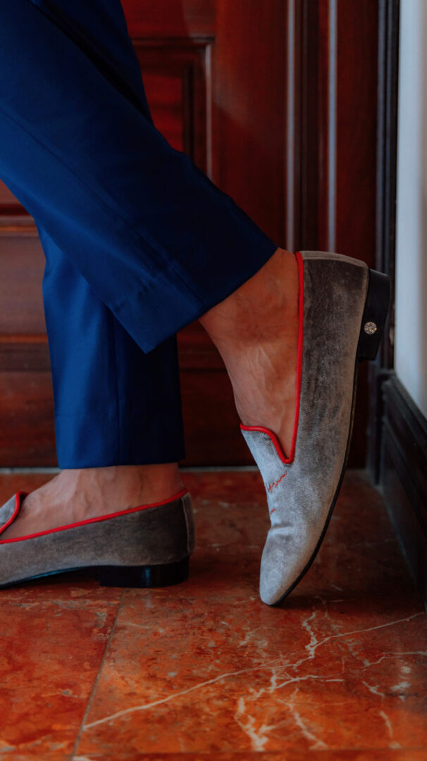 Grey and red color low heel loafer with gemstone