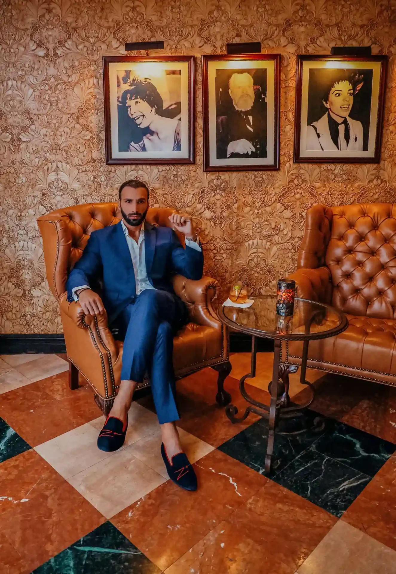 A man sitting on a brown couch